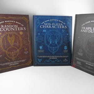 May include: Three hardcover books titled The Game Master's Book of Random Encounters, The Game Master's Book of Non-Player Characters, and The Game Master's Book of Traps, Puzzles and Dungeons, featuring gold, blue, and silver line art on covers.