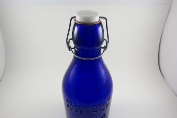 Vintage Old Thatchers Dairy Absolutely Pure Milk Bottle Cobalt Blue Glass 10 1/2 Inches Tall With Cow Emblem Wire Top 1 Quart