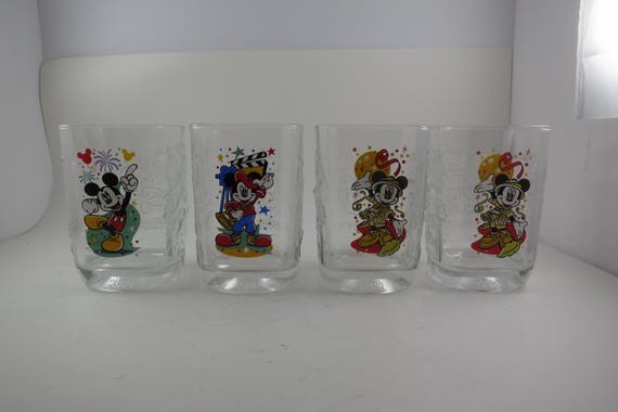Collection of Four  McDonalds 2000 Millennium Glasses Walt Disney World Magic Kingdom 4 1/2 Inches Tall Embossed Pristine Condition