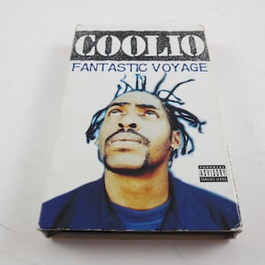 May include: A cassette tape case with a photo of Coolio on the front. The case is white with black text that reads "Coolio" and "Fantastic Voyage".