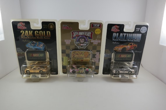 Set of Three Vintage NASCAR Racing Champions Platinum and 24K Gold Plated Die Cast Cars New In Package Lake Speed Sterling Marlin