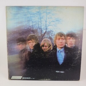 May include: Vintage album cover featuring a group of five men. The cover art has a blurred, atmospheric quality with a muted color palette. The word "MONO" is visible on the bottom left.