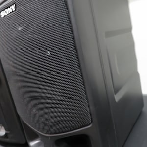May include: Black Sony stereo system with a mesh speaker cover. The stereo has a control panel with buttons and a dial. The Sony logo is visible on the speaker.