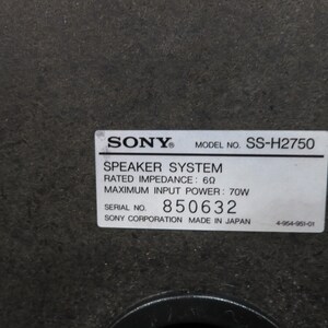 May include: A close-up of a speaker system label. The label displays "SONY" and "MODEL NO. SS-H2750". It also states "SPEAKER SYSTEM", "RATED IMPEDANCE: 6&Omega;", and "MAXIMUM INPUT POWER: 70W". The serial number is 850632.