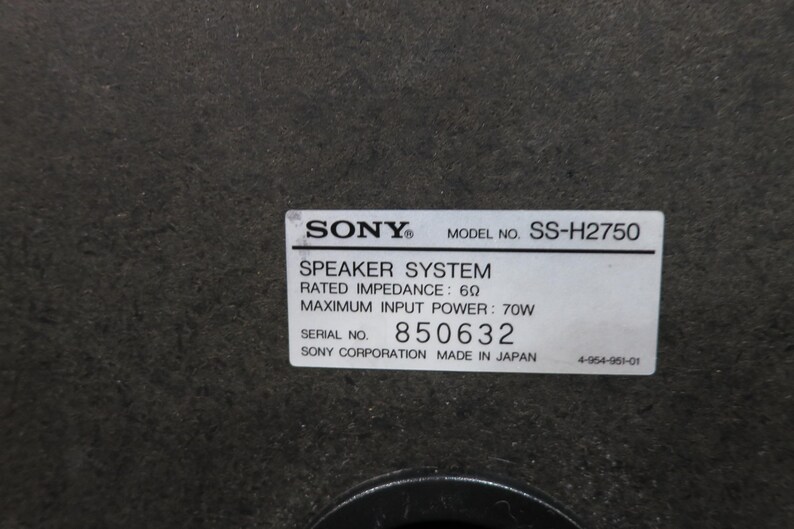 May include: A close-up of a speaker system label. The label displays "SONY" and "MODEL NO. SS-H2750". It also states "SPEAKER SYSTEM", "RATED IMPEDANCE: 6&Omega;", and "MAXIMUM INPUT POWER: 70W". The serial number is 850632.