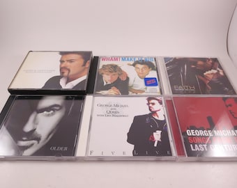 May include: A selection of music CDs featuring George Michael and Wham! album covers. The CD cases are clear plastic and display images of the artists. Titles include "Faith", "Older", and "Five Live".