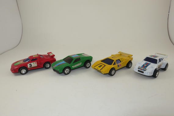 Collection of 4 Vintage Diecast Friction Cars Lancia White Porsche Green BMW Yellow Lamborghini