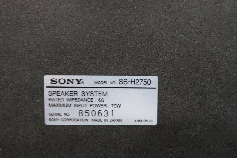 May include: A close-up of a label on a speaker system. The label reads "SONY" and "MODEL NO. SS-H2750". It also lists "SPEAKER SYSTEM", "RATED IMPEDANCE: 6&Omega;", and "MAXIMUM INPUT POWER: 70W". The serial number is 850631.