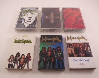 May include: Six cassette tapes with the band name "Winger" printed on the front. The tapes are in a variety of colors, including red, blue, and black. The tapes are all in plastic cases.