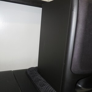 May include: A black Sony bookshelf speaker with a rectangular cabinet and a fabric grille covering the front driver. The speaker features a smooth matte finish on the side panel and a small port opening located at the bottom of the front face.