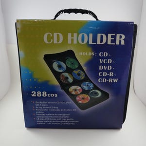 Estuche vintage de 288 CD/DVD, sin usar, año 2005, con asa y pestillo, nuevo en su caja.