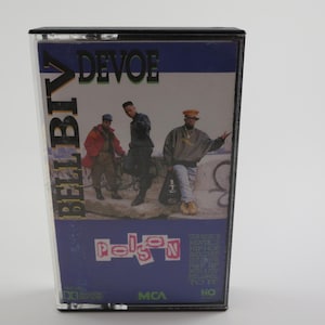 May include: A cassette tape with a blue, purple, and white background. The cassette tape features a photo of three men in front of a graffiti wall. The text "Bell Biv DeVoe" is printed in gold letters on the left side of the cassette tape. The text "Poison" is printed in pink letters on the bottom of the cassette tape.