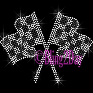 May include: Two white and black checkered flags made of rhinestones, crossed over each other. The flags are on a black background with sparkling stars.