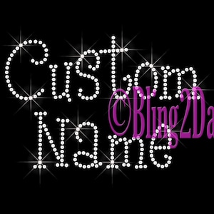 May include: Custom Name with rhinestones, a sparkly design with the text "Custom Name" and the logo "Bling2Day" in purple.