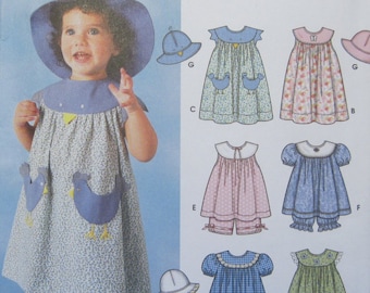 Simplicity 7189 -- Babies and Toddlers Dress, Top, Panties and Hat pattern. Sizes 1/2, 1, 2, 3, 4. Pattern is uncut and factory folded.