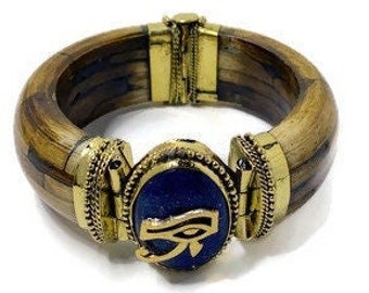 Women's History Month! Eye of Ra charm/Lapis lazuli stone on a hinged bracelet. For a small wrist. #AncientEgyptian #StraightPathJewelry