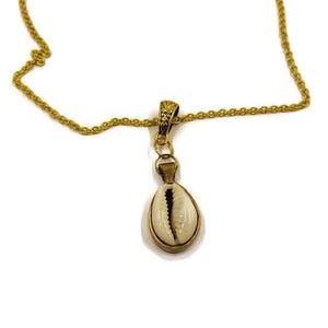African cowrie shell on a 20-inch gold-plated chain. African-inspired jewelry. #EgyptianKemeticJewelry #Cowrie #CowrieShell #Cowery