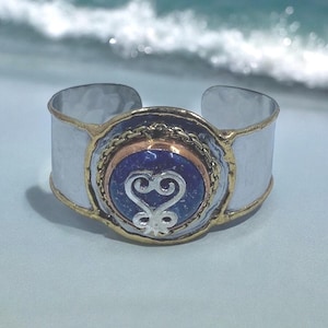 Lapis Lazuli stone and the Sankofa Adinkra symbol on a stainless-steel bracelet. #Adinkra #Ghana #Sankofa #AfricanCulture