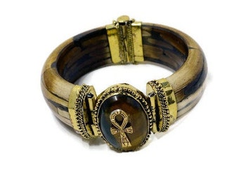 Women's History Month! Ankh charm with a Tiger's Eye gemstone on a hinged bracelet. #StraightPathJewelry #Afrocentric