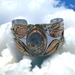 Maat charm adorning a stunning moss agate stone cuff bracelet. #AncientEgyptian #EgyptianKemeticJewelry #Maat #Ma&#39;at #MossAgate