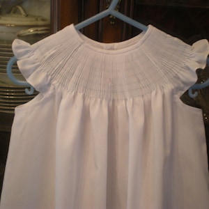 Ready to smock dress with angel sleeves Ready to ship. Size 6 months.