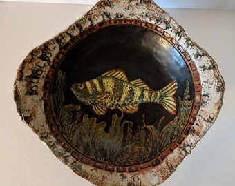 Walleye swimming in the dark waters