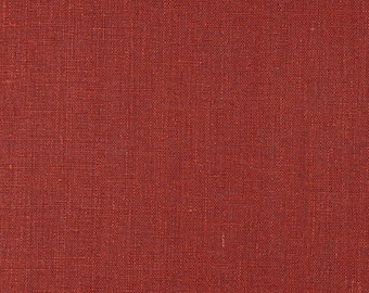May include: A close-up of a red fabric with a woven texture.