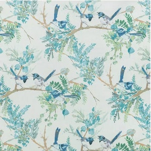 May include: A repeating pattern of watercolor-style birds perched on branches with blue-green foliage. The birds have blue, white, and gray feathers. The branches are a light brown color, and the background is off-white.