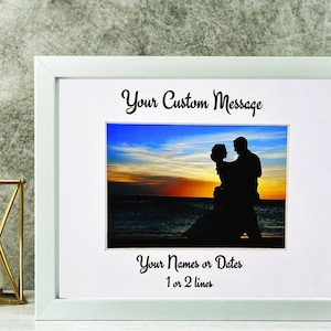 May include: White framed photo with a sunset silhouette of a couple. The frame has the text "Your Custom Message" above the photo and "Your Names or Dates 1 or 2 lines" below the photo.