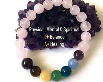 May include: A 7 Chakra bracelet made with rose quartz beads. The bracelet features seven different colored beads representing the seven chakras. The text on the image reads "Physical, Mental & Spiritual Balance Healing".