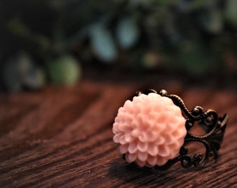 Pink flower ring, with adjustable filigree gold coloured band
