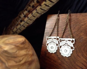 White lace, and antique gold geometric chain earrings, with floral design.