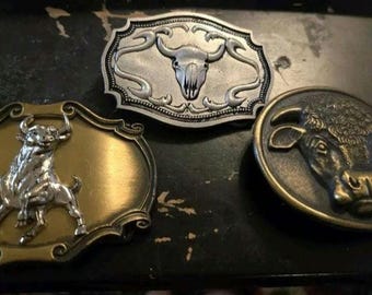 3 Longhorn Belt Buckles, 1 Malcom Hereford 1975, Monster Belt Buckle 2000 & 1 raintree 1978