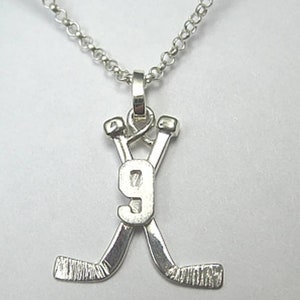 Hockey stick cross necklace deals