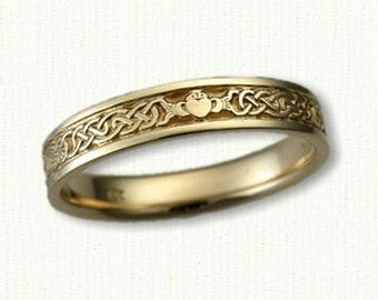 May include: A gold Celtic knot wedding band with a Claddagh design in the center.