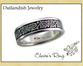 May include: A silver band ring with a Celtic knot design. The ring is engraved with a detailed pattern of interlacing knots.
