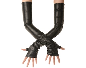 May include: Black, fingerless, faux leather gloves extending to the upper arm. The gloves are shown with the arms crossed, and the hands are open. The gloves have a smooth, shiny appearance and are set against a white background.
