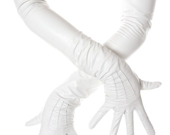 May include: A pair of long white leather gloves with a ruffled detail at the wrist.