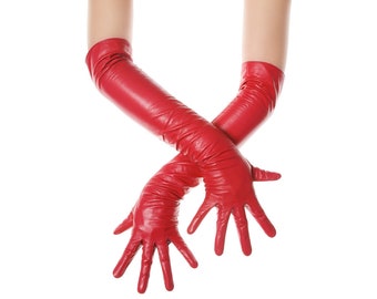 May include: A pair of long, bright red gloves. The gloves are made of a shiny material and extend well past the elbows. The hands are crossed, with the fingers spread, against a white background. The gloves appear to be made of leather.