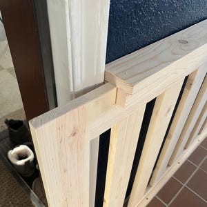Sliding guide and traditional style gate