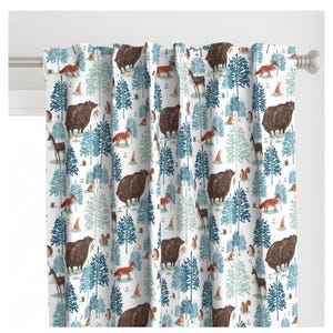 May include: White fabric with a repeating pattern of blue and green trees, brown bears, red foxes, and other woodland creatures.