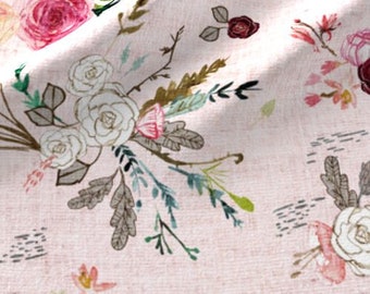 May include: A pink fabric with a floral pattern featuring white and pink roses, green leaves, and brown branches. The background is a light pink with a subtle texture.