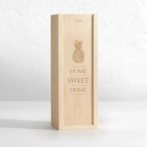 May include: A wooden box with a pineapple design and the text "Home Sweet Home" engraved on the front.