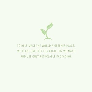 May include: A green plant sprout with the text "TO HELP MAKE THE WORLD A GREENER PLACE, WE PLANT ONE TREE FOR EACH ITEM WE MAKE AND USE ONLY RECYCLABLE PACKAGING."