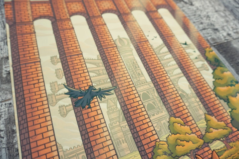 May include: A close-up of a brick archway with a view of a distant city. The city is made of stone and has many towers. A black crow flies through the archway.