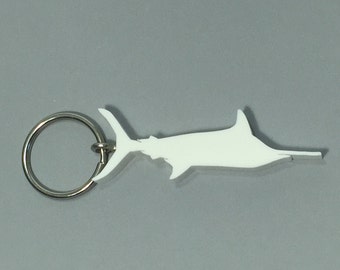 May include: White plastic swordfish keychain with a silver key ring.