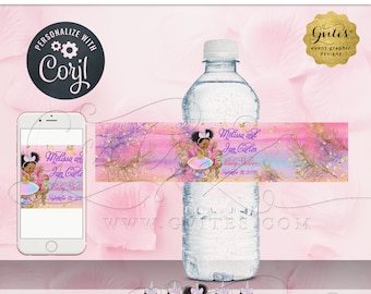 May include: A water bottle with a custom label featuring a watercolor pink, blue, and purple background with gold glitter accents. The label displays an illustration of a baby in a crown, the text Melissa and Ian Carlos Baby Shower September 1st, 2019.