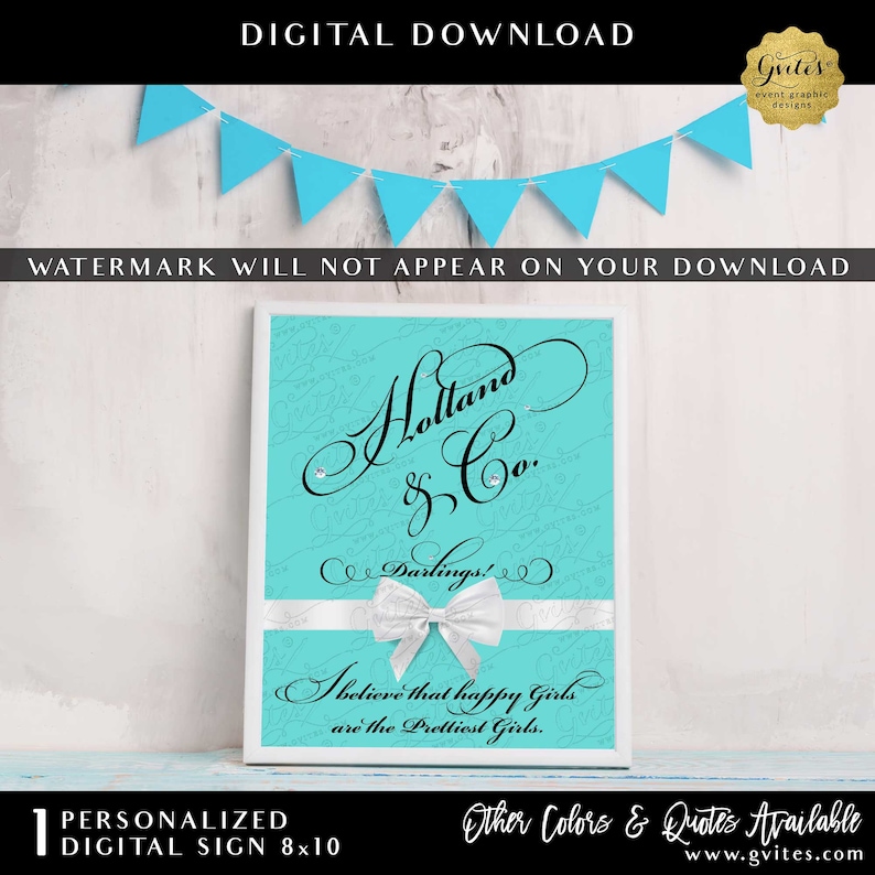 May include: A rectangular sign with a bright turquoise background featuring black cursive text that reads Holland & Co. Darlings! I believe that happy Girls are the Prettiest Girls. A white ribbon with a bow is centered across the lower portion.