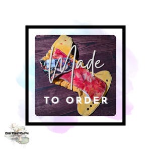 May include: A yellow and red cloth diaper with the words "Made To Order" in white. The diaper has a colorful patterned interior and is surrounded by a black border.