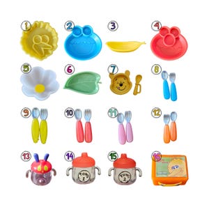 May include: A collection of sixteen children's mealtime items including character-shaped plates, bowls, and cups. Items include a yellow sun plate, blue and red character plates, a banana bowl, a flower bowl, a leaf plate, and various spoons and forks.